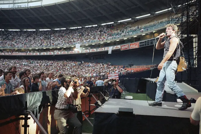 A photo of Bruce Springsteen performing at RFK Memorial Stadium in Washington, D.C. in 1985